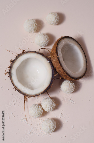 sliced ​​coconut and coconut candy on a white background