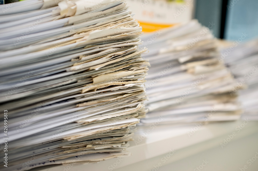 Shop desk full of guest orders sheets Shop desk full of guest orders sheets