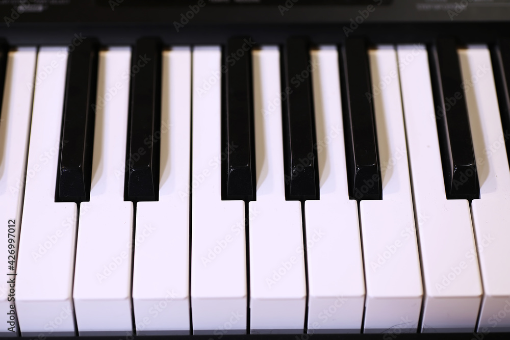 Old piano keys. close up view.effect back and white color, musical instrument background concept Old piano keys. close up view.effect back and white color, musical instrument background concept