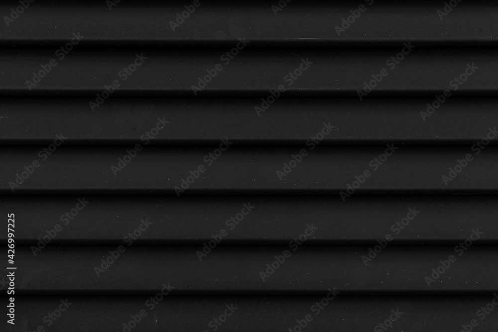 Old black painted wooden house wall peeling paint texture and background seamless Old black painted wooden house wall peeling paint texture and background seamless