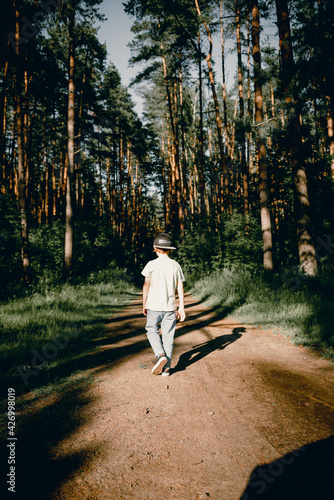 Boy walk in the forest