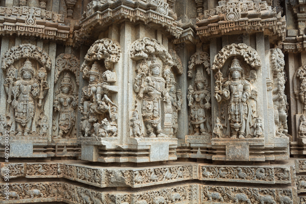 A Detail Stone sculpture of Indian deities on a temple exterior , India is blessed with thousands of  magnificent stone temples and is a great tourist attraction.