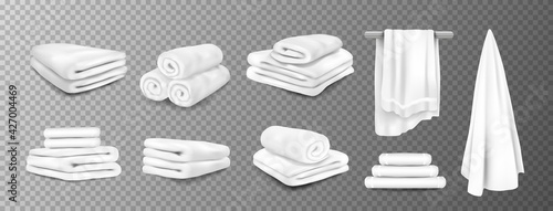 Bath towels. Realistic white hospital and hotel white bathroom hanging terry cloth. 3D fluffy fabric rolled and folded. Vector stack of textile toiletries set on transparent background