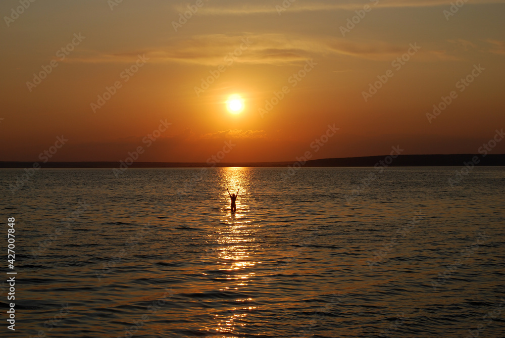 Swimming at sunset