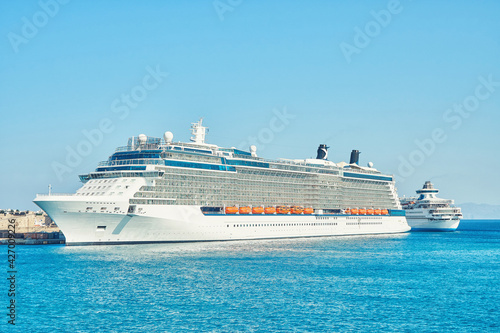 Large white tourist cruise ship on blue rippling sea © timltv