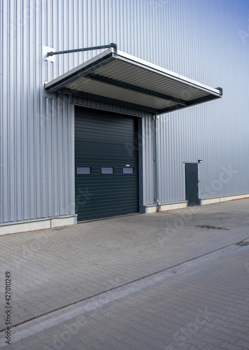 Closed gate of a warehouse delivery. Rolling shutter of a distribution center.