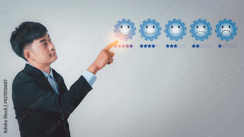 Businessman pointing to the cog icon Businessman pointing to the cog icon