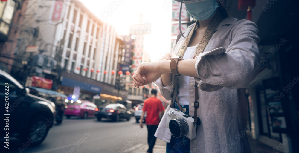 Fototapeta premium Close up hand woman people wear smart watch checking time and health information at outdoor.