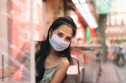 Happy asian adult woman wear protect mask for new normal life.