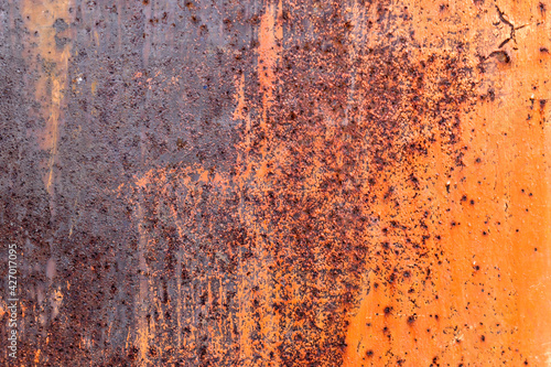 Rusty painted metal surface with flecks and scratches