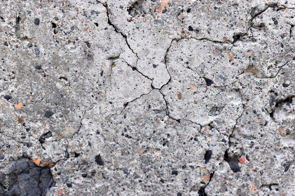 The surface of an old cinder block falling apart The surface of an old cinder block falling apart