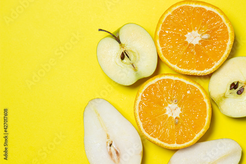 Sliced fruits on a yellow background. Healthy diet. fruit theme. Bright fruit