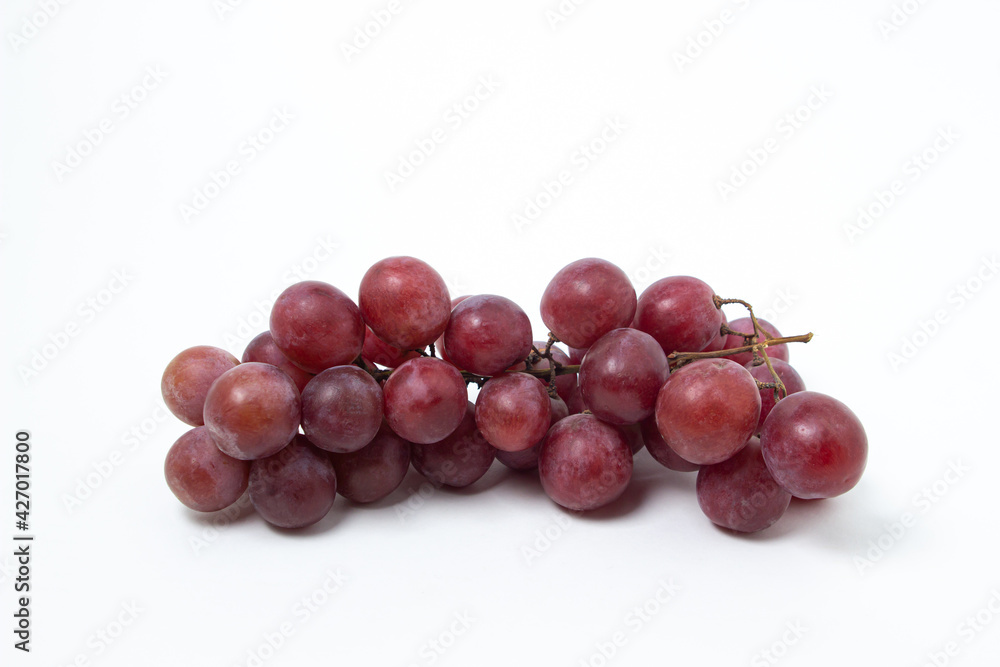 Grapes on a white background. Isolated pink grapes. Bunch of grapes