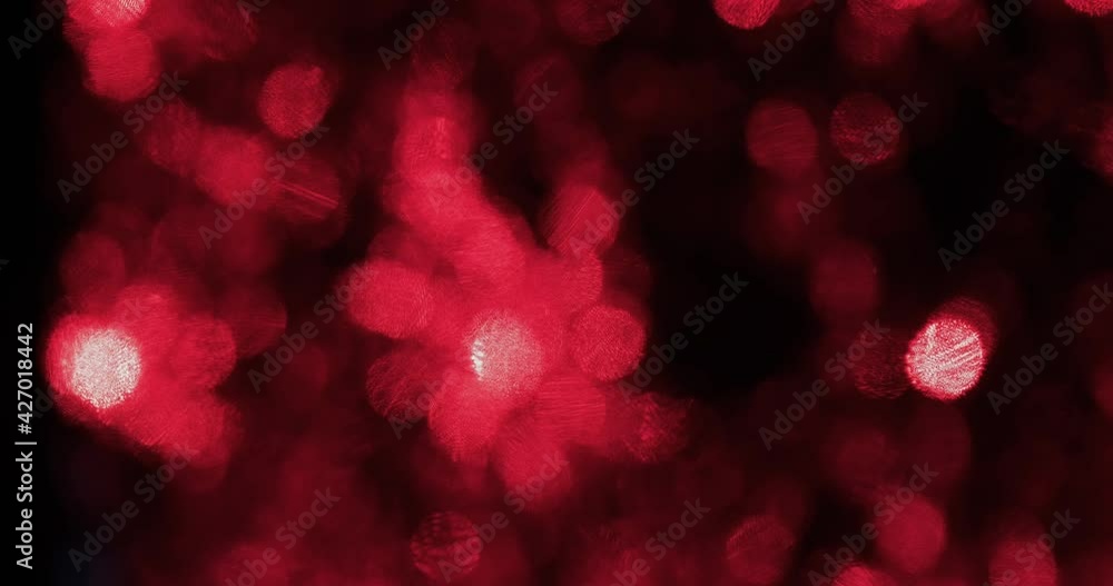 Flashing unusual bokeh of green and red lights. Blink and move colorful christmas lights bokeh effect. Artistic, abstract defocused background for your design. Abstract background. Flashing unusual bokeh of green and red lights. Blink and move colorful christmas lights bokeh effect. Artistic, abstract defocused background for your design. Abstract background.
