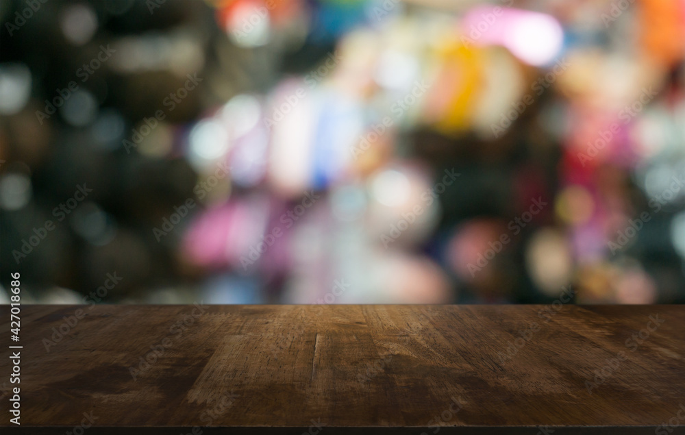 Empty wooden table in front of abstract blurred background of coffee shop . can be used for display or montage your products.Mock up for display of product Empty wooden table in front of abstract blurred background of coffee shop . can be used for display or montage your products.Mock up for display of product
