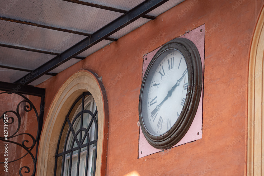 Antique Clock with Roman Numerals Placed on the Wall of the Local Public Transport Bus Headquarters, Parma - Italy