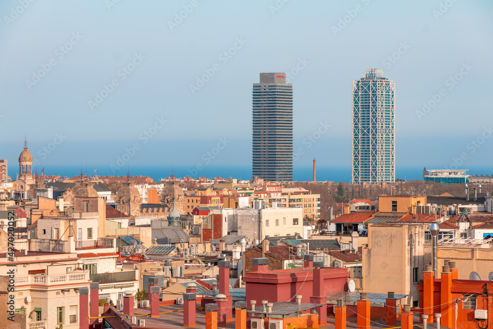 Picture of the famous Barcelona twin towers (Arts Hotel and Mapfre Tower) captured in a sunny day. Barcelona, Spain. 