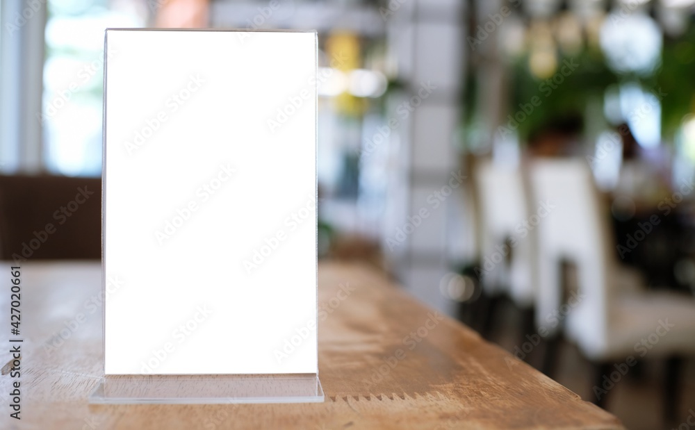 Menu frame standing on wood table in Bar restaurant cafe. space for text marketing promotion. Menu frame standing on wood table in Bar restaurant cafe. space for text marketing promotion.
