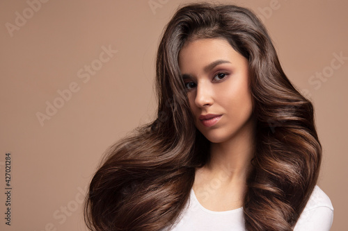 Portrait of a woman with luxurious hair and a beautiful smile. Asian appearance