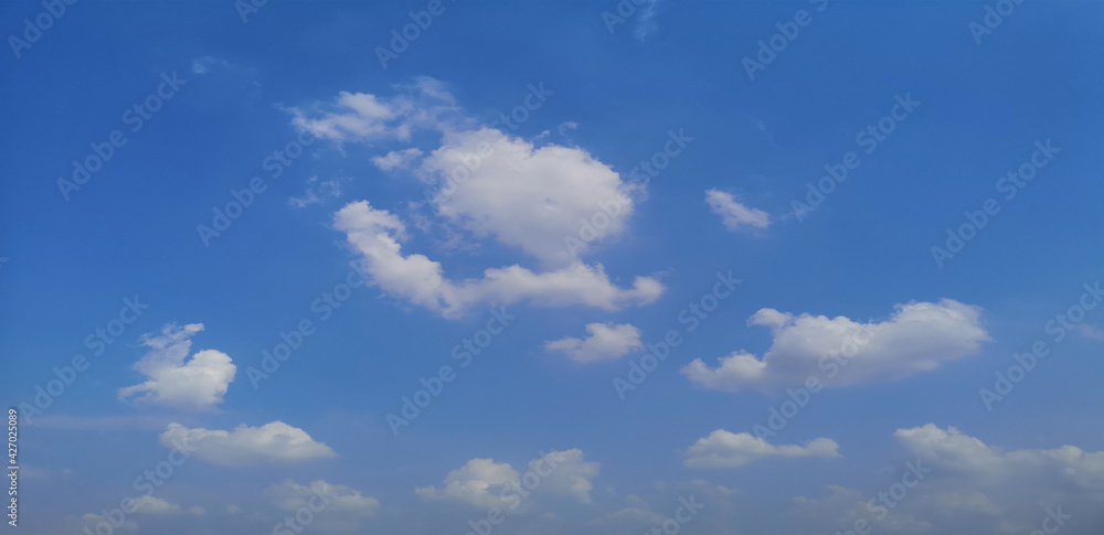 Cumulus white clouds in the blue sky natural background beautiful nature space for write Cumulus white clouds in the blue sky natural background beautiful nature space for write