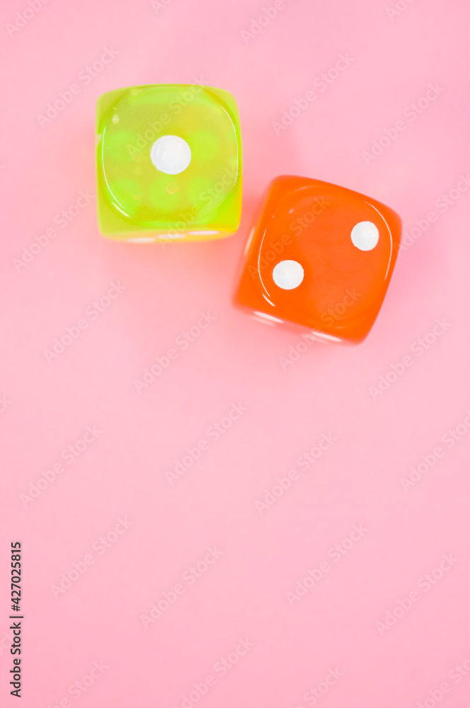two dice on a pink background - top view two dice on a pink background - top view