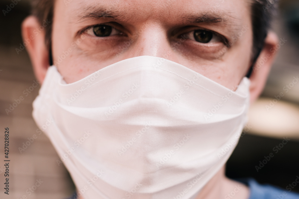 A man wearing handmade cotton face mask. Coronavirus, COVID-19