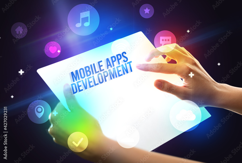 Holding futuristic tablet, new media concept Holding futuristic tablet, new media concept