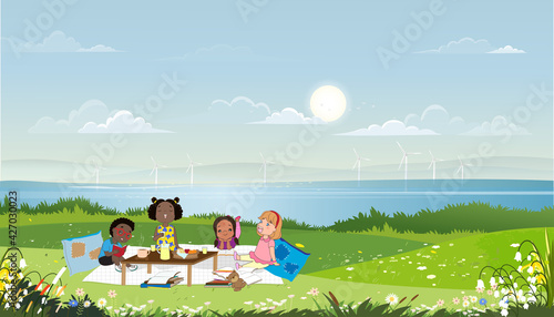 Group of kids having picnic by the lake in sunny day spring or summer,Children sitting on blanket reading and eating snacks. Mixed race kids relaxing outdoor,World book day, Education concept