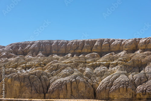 Eroded landscape and rock towers in Zanda soil forest photo