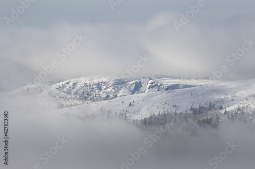 view of a ski resort above the clouds during holiday