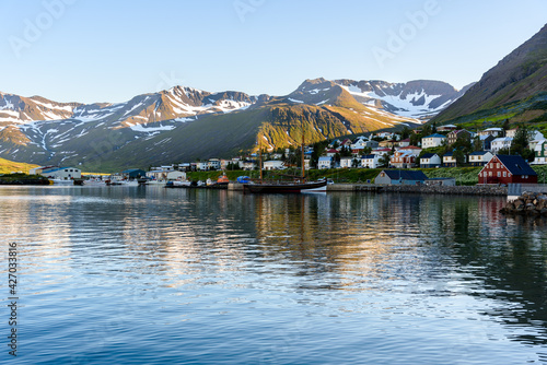 Small fishing town in a narrow fjord along the northen coast of Iceland on a clear summer day. Siglufjordur, Iceland. photo