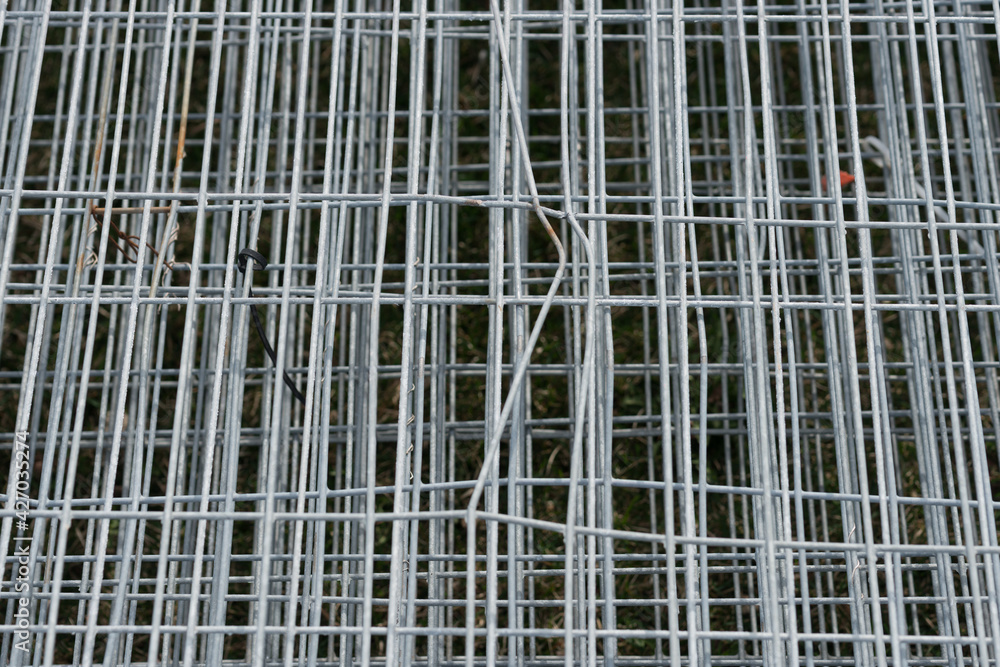 detail of galvanized construction site fencing in a pile on the floor