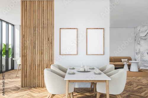 Bright modern dining room interior with large sofa © ImageFlow
