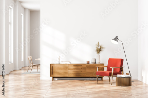 Bright contemporary waiting room interior with wooden sideboard