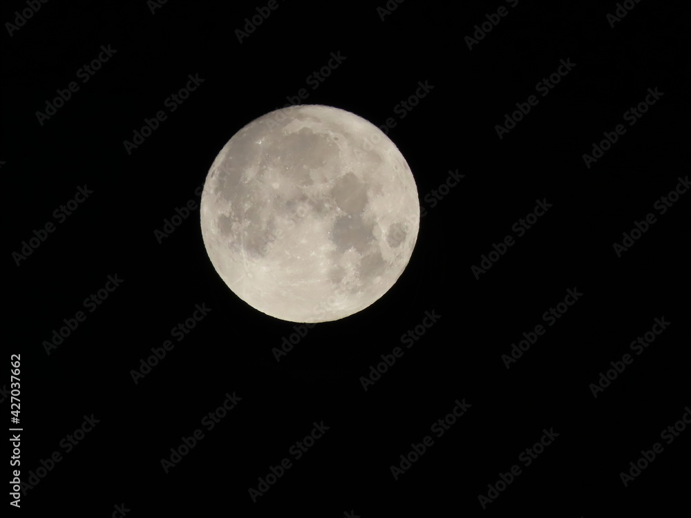 The beautiful full moon on the background of the night sky close-up in Israel. The beautiful full moon on the background of the night sky close-up in Israel.