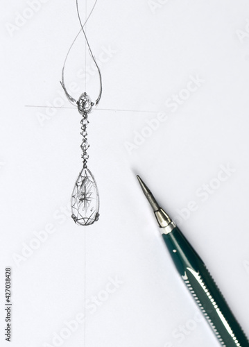 The sketch is designing jewelry pendant.