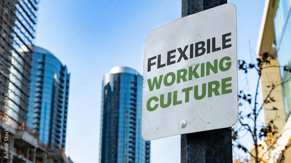 Flexible Working Culture on Worn Sign in Downtown city setting Flexible Working Culture on Worn Sign in Downtown city setting