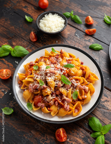 Conchiglie alla Amatriciana pasta with pancetta bacon, tomatoes and pecorino cheese. Healthy Italian food