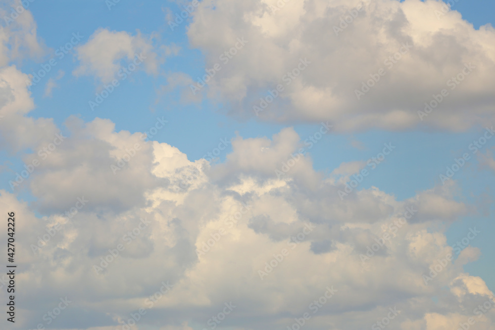 Blue sky with white clouds in the daytime background. Blue sky with white clouds in the daytime background.
