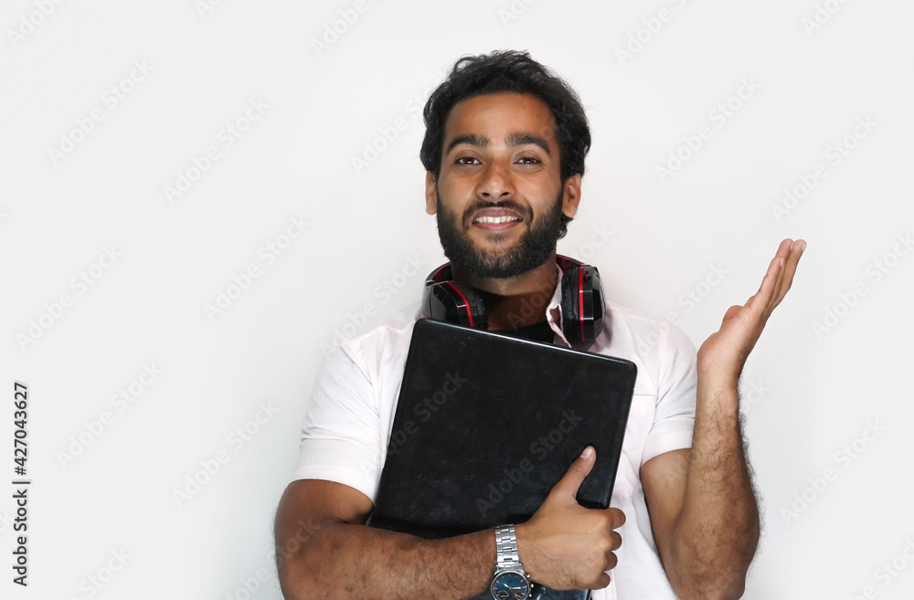 Handsome young man with laptop on white background - education concept Handsome young man with laptop on white background - education concept