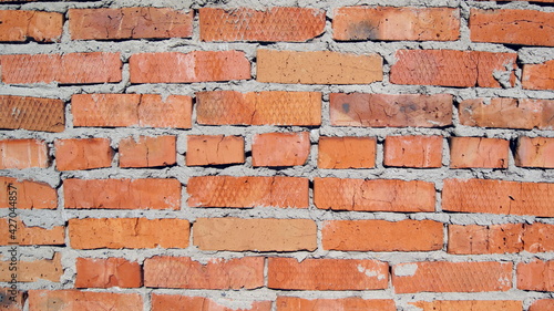 brick old wall of uneven red brick
