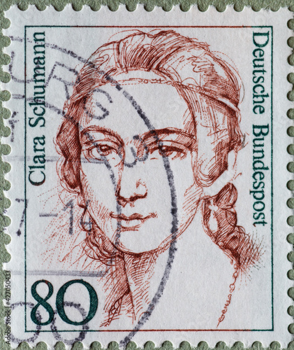 GERMANY - CIRCA 1986 : a postage stamp from Germany, showing a woman from German history the pianist, composer, piano professor Clara Schumann photo