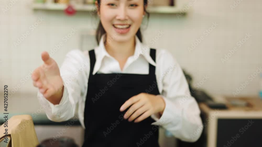 Customer paying with qr code on smartphone screen NFC payment technology at coffee shop.Midsection of female staff showing contactless menu QR code on digital mobile. Customer paying with qr code on smartphone screen NFC payment technology at coffee shop.Midsection of female staff showing contactless menu QR code on digital mobile.