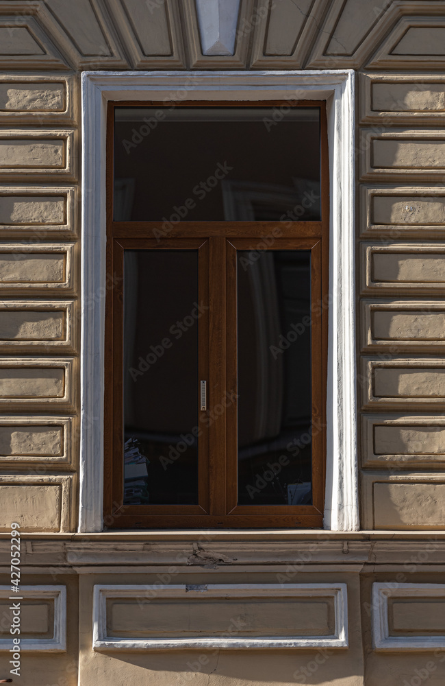 Windows on old city facades, with decorative elements