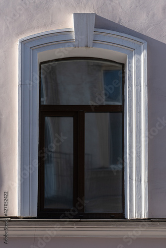 Windows on old city facades, with decorative elements