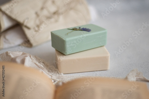 two bars of fragrant soap, green and beige