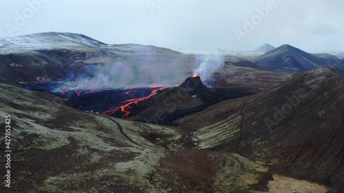 A volcano in the Reykjanes peninsula in Iceland. The eruption site consists of several craters in an enclosed valley where the largest vent is roughly 100 meter high. photo