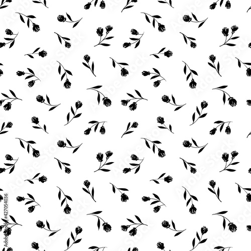 Black tulips vector seamless pattern. Hand drawn silhouettes of spring flowers, tulips, narcissus and iris. Dry brush style floral motives. Black paint illustration with abstract flowers