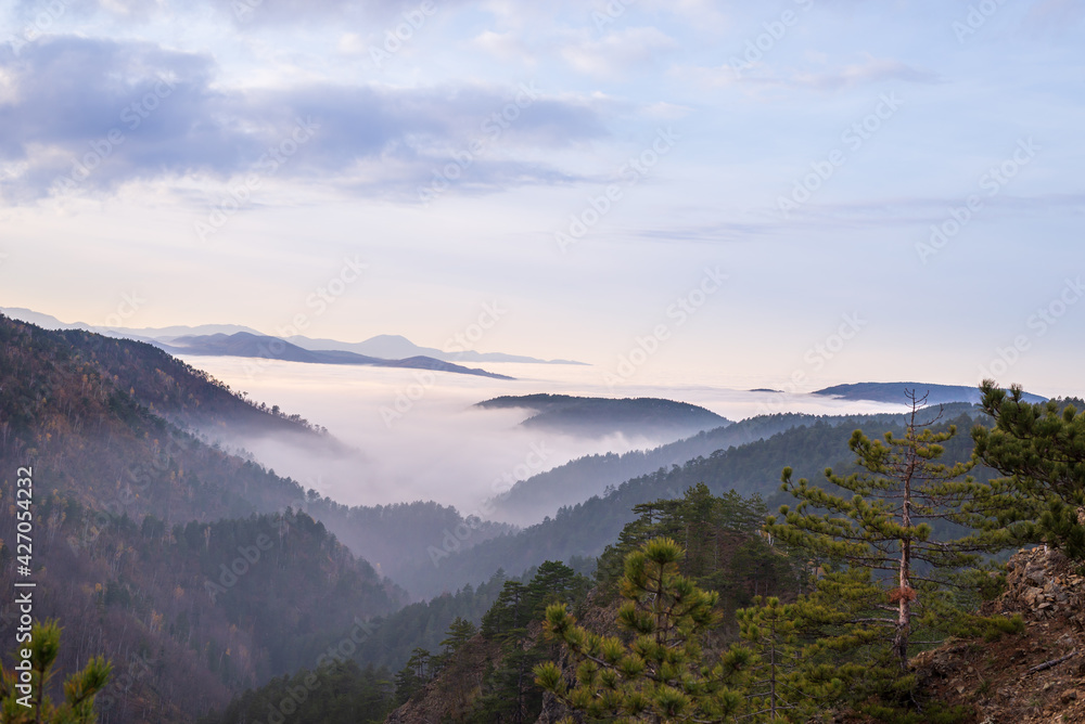 Hills above clouds viewed from a mountain top Hills above clouds viewed from a mountain top