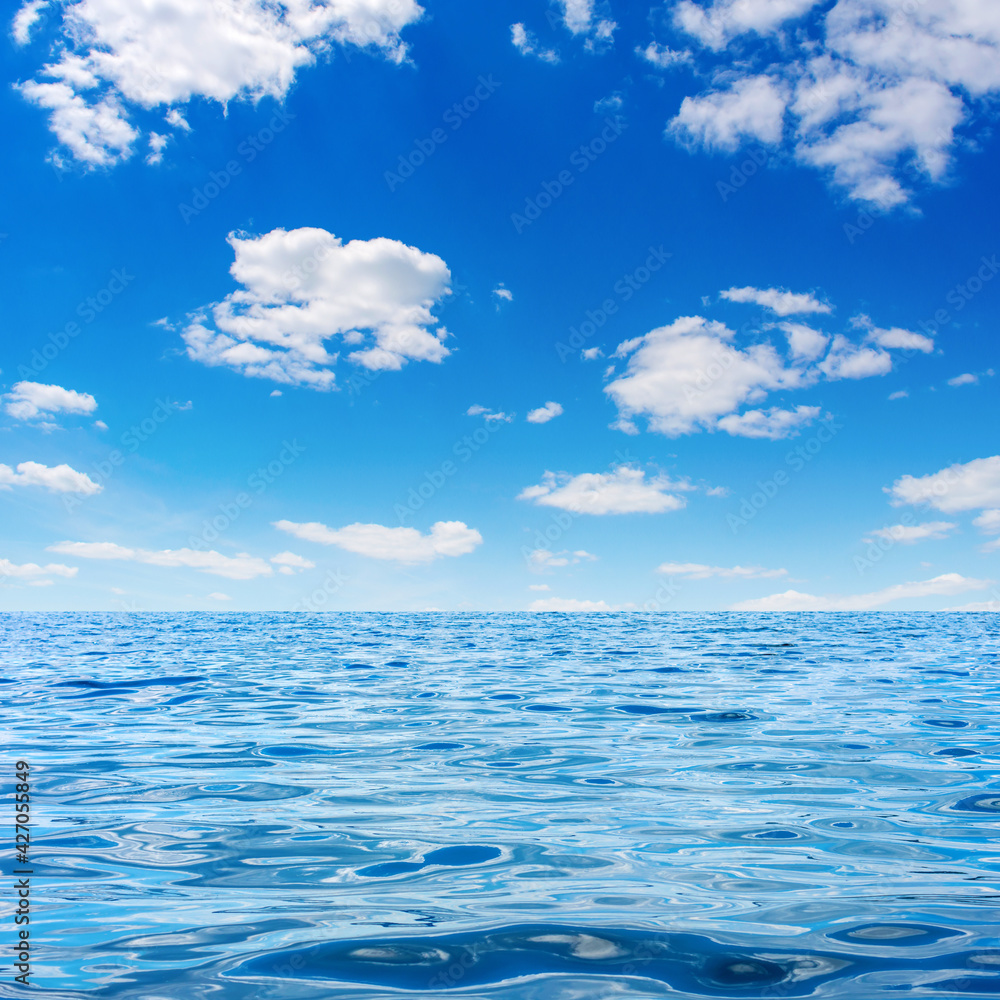 Photo of blue clear bay waves with sky and clouds Photo of blue clear bay waves with sky and clouds